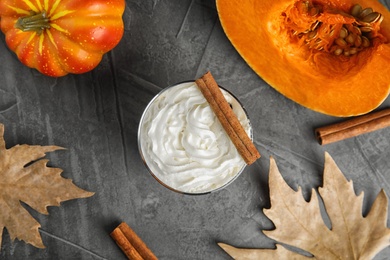 Photo of Flat lay composition with pumpkin spice latte on gray background