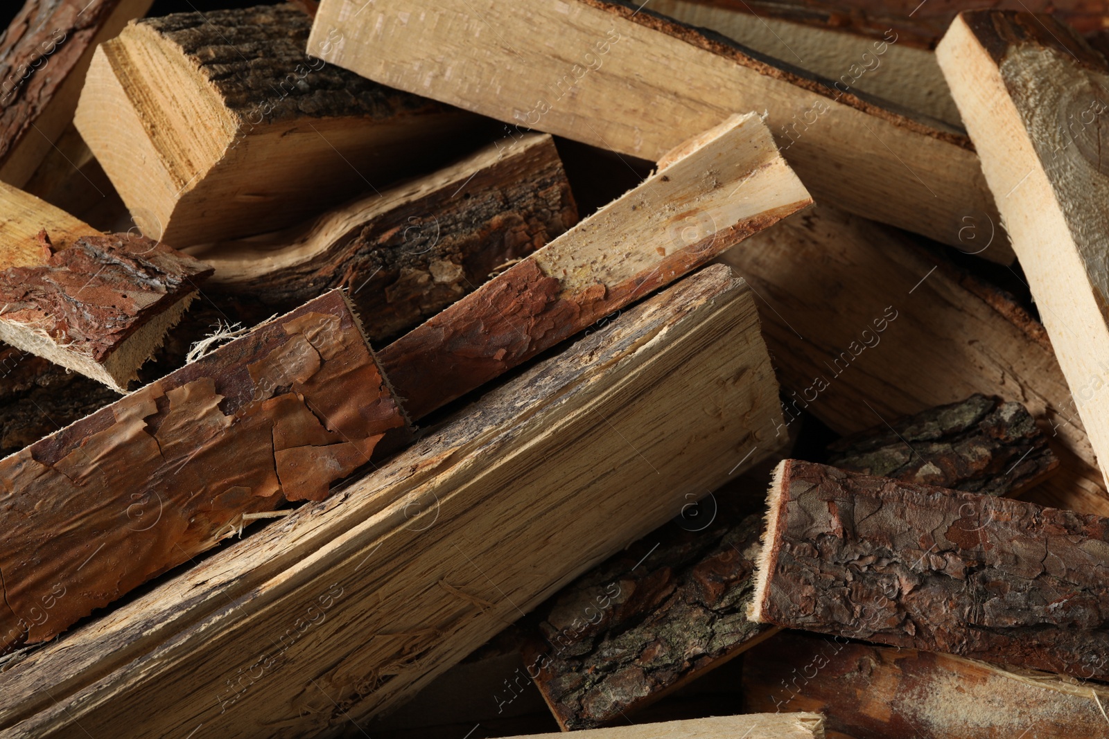 Photo of Cut firewood as background, closeup. Heating in winter