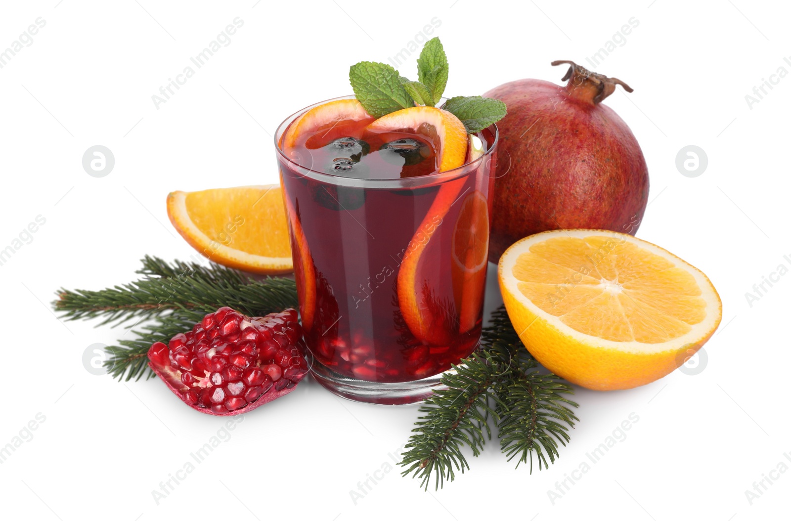 Photo of Aromatic Christmas Sangria drink in glass, fir branches and ingredients isolated on white