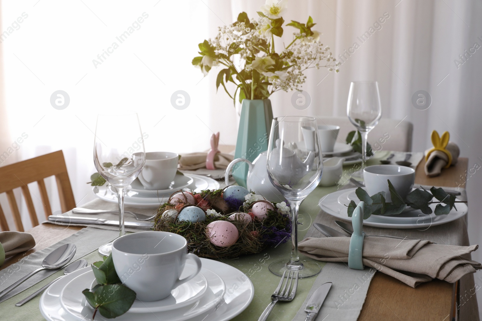 Photo of Beautiful Easter table setting with festive decor indoors