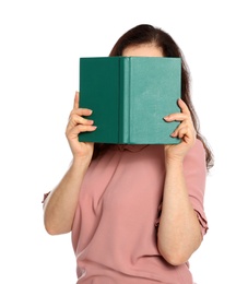 Mature woman reading book on white background