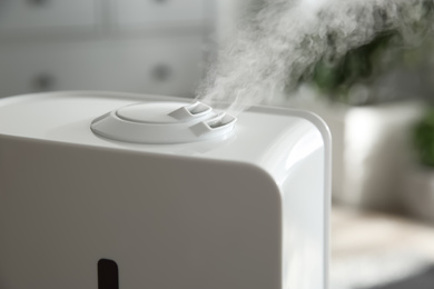 Modern air humidifier at home, closeup view