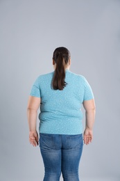 Photo of Overweight woman before weight loss on color background