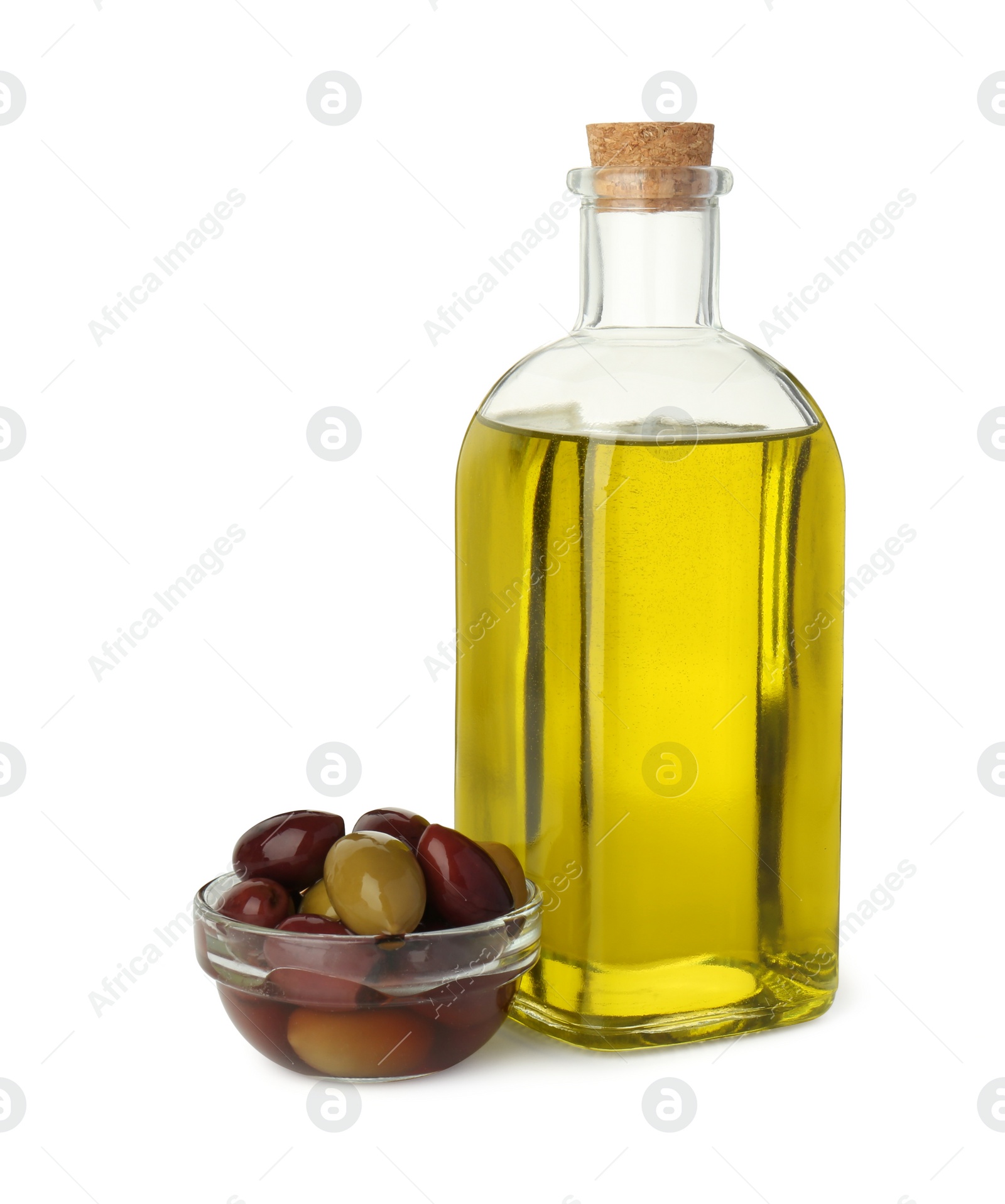 Photo of Vegetable fats. Bottle of cooking oil and olives isolated on white