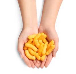 Photo of Woman holding pile of crunchy cheesy corn sticks on white background, top view