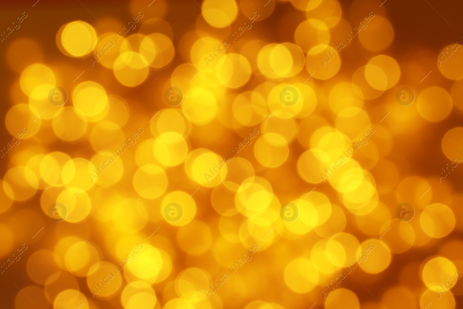 Photo of Blurred view of Christmas lights on dark background