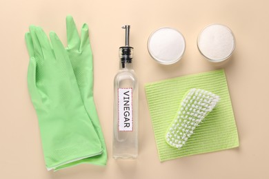 Photo of Eco friendly natural cleaners. Flat lay composition with bottle of vinegar on beige background