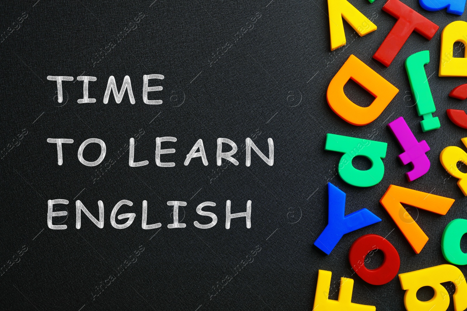 Image of Blackboard with text Time o Learn English and plastic letters, top view