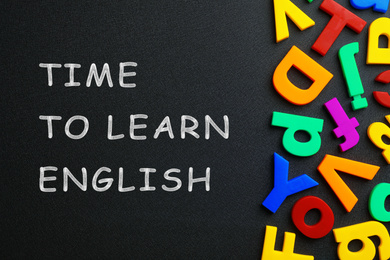 Image of Blackboard with text Time o Learn English and plastic letters, top view
