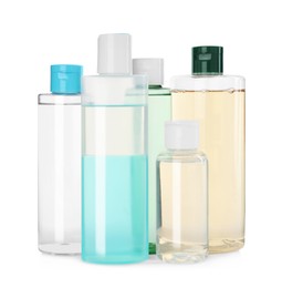 Photo of Bottles of micellar cleansing water on white background