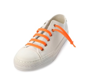 Photo of Sportive shoe with orange silicone laces isolated on white