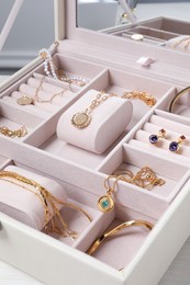 Beautiful bijouterie in jewel box on table