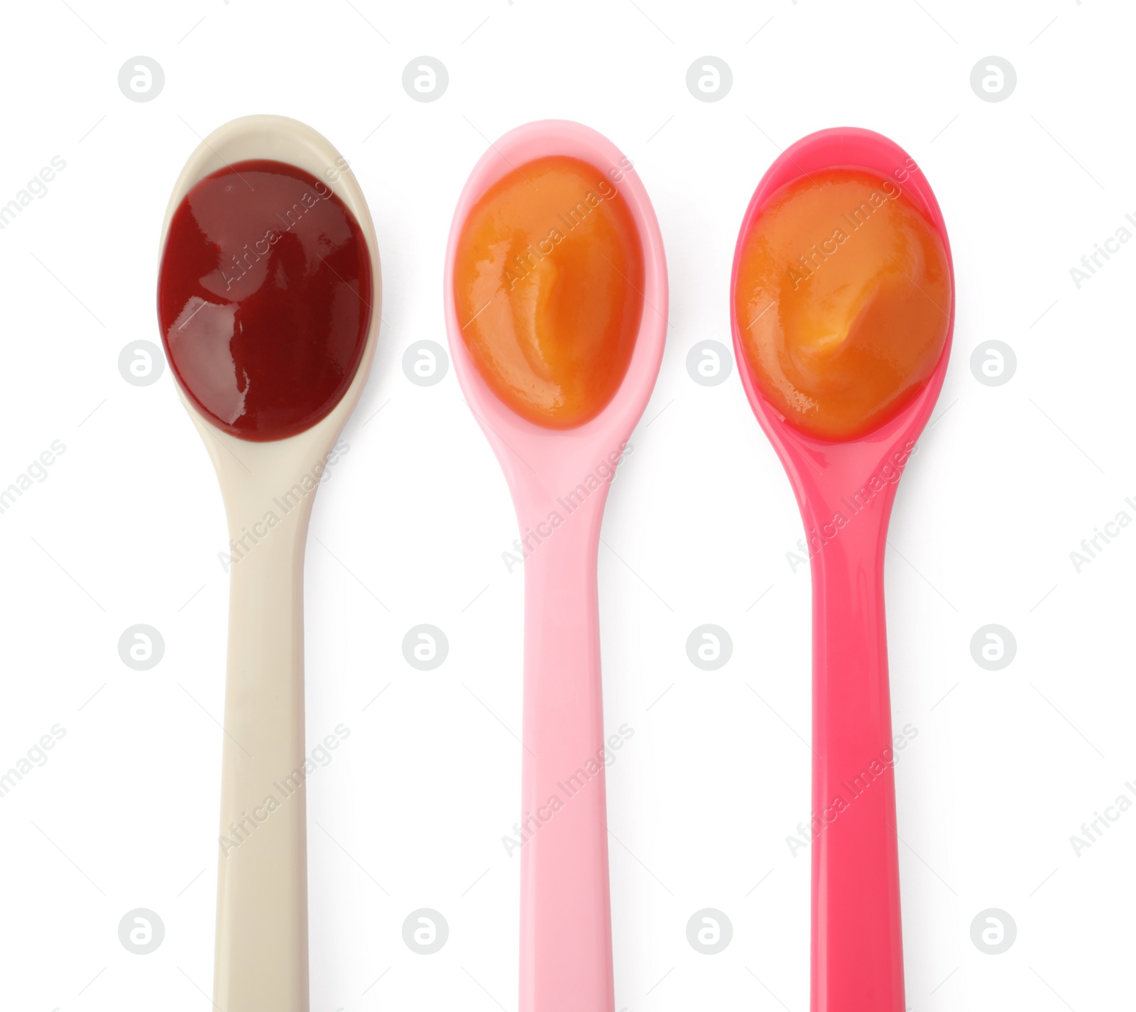 Photo of Spoons of tasty pureed baby food isolated on white, top view