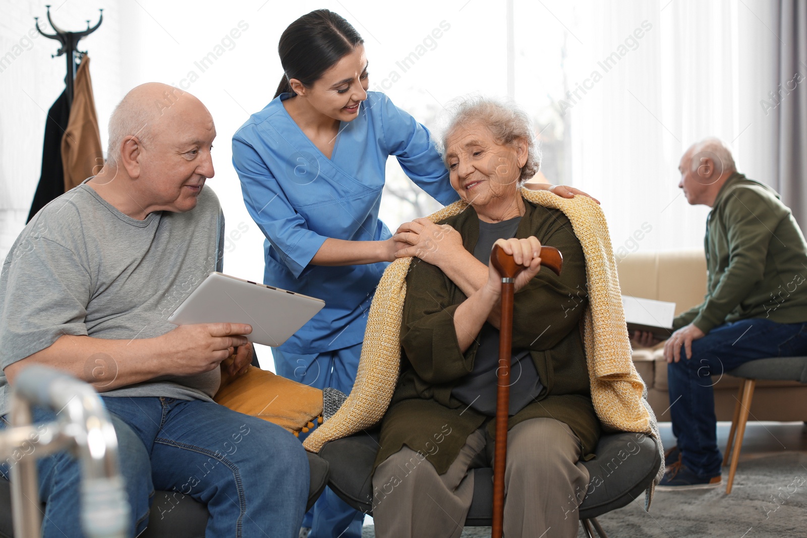 Photo of Nurse taking care of elderly patients in geriatric hospice