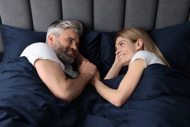 Photo of Lovely mature couple in bed at home