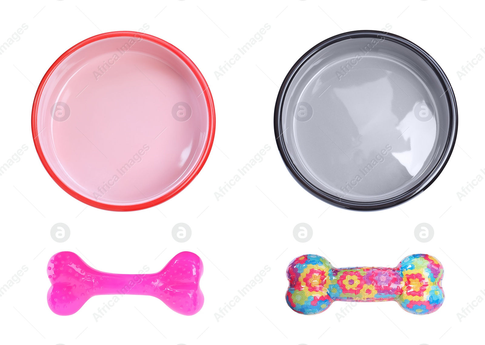 Image of Set with feeding bowls and toys for pet on white background, top view