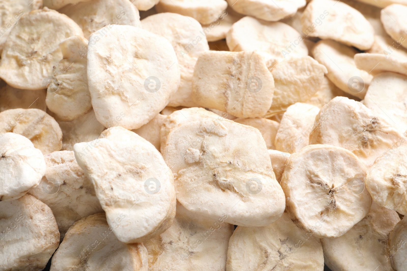 Photo of Closeup of freeze dried bananas as background