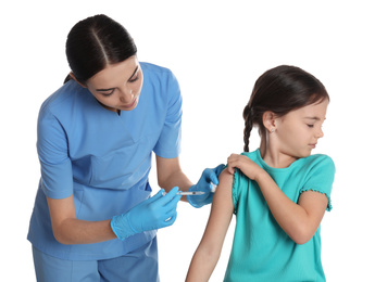 Photo of Doctor vaccinating little child on white background