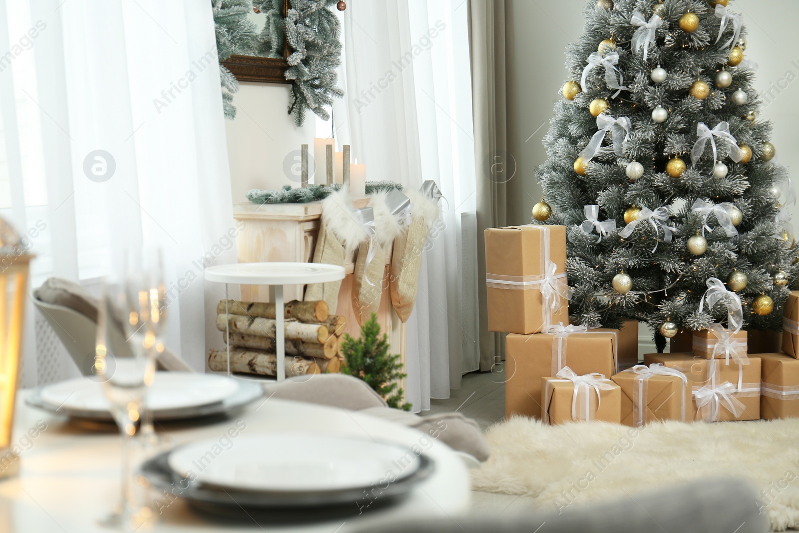 Photo of Decorated Christmas tree in modern living room interior