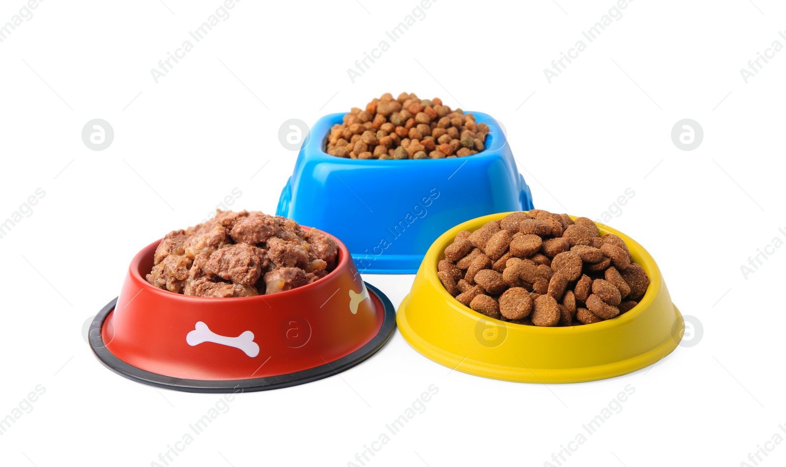 Photo of Dry and wet pet food in feeding bowls on white background