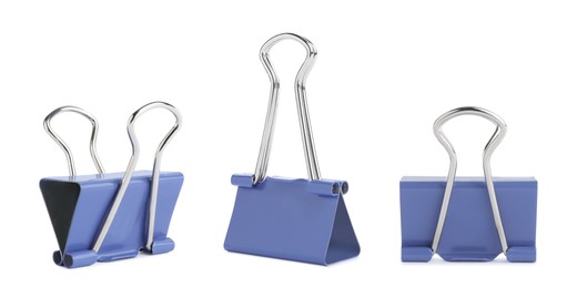 Set with light blue binder clips on white background