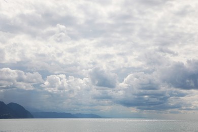 Picturesque view of sea under beautiful sky with fluffy clouds