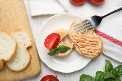 Fresh bread with delicious meat pate served on white wooden table, flat lay