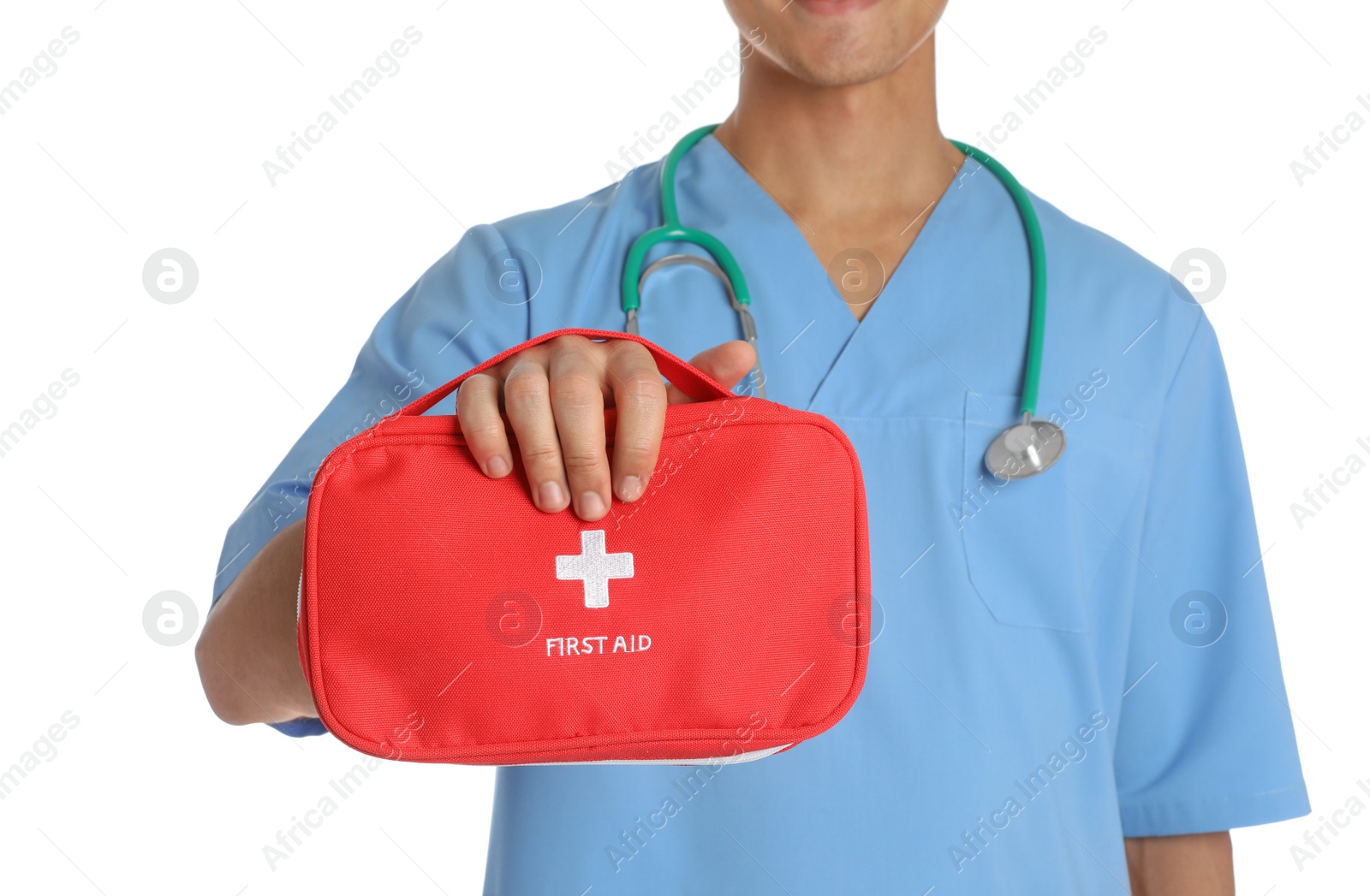 Photo of Male doctor holding first aid kit on white background, closeup. Medical object