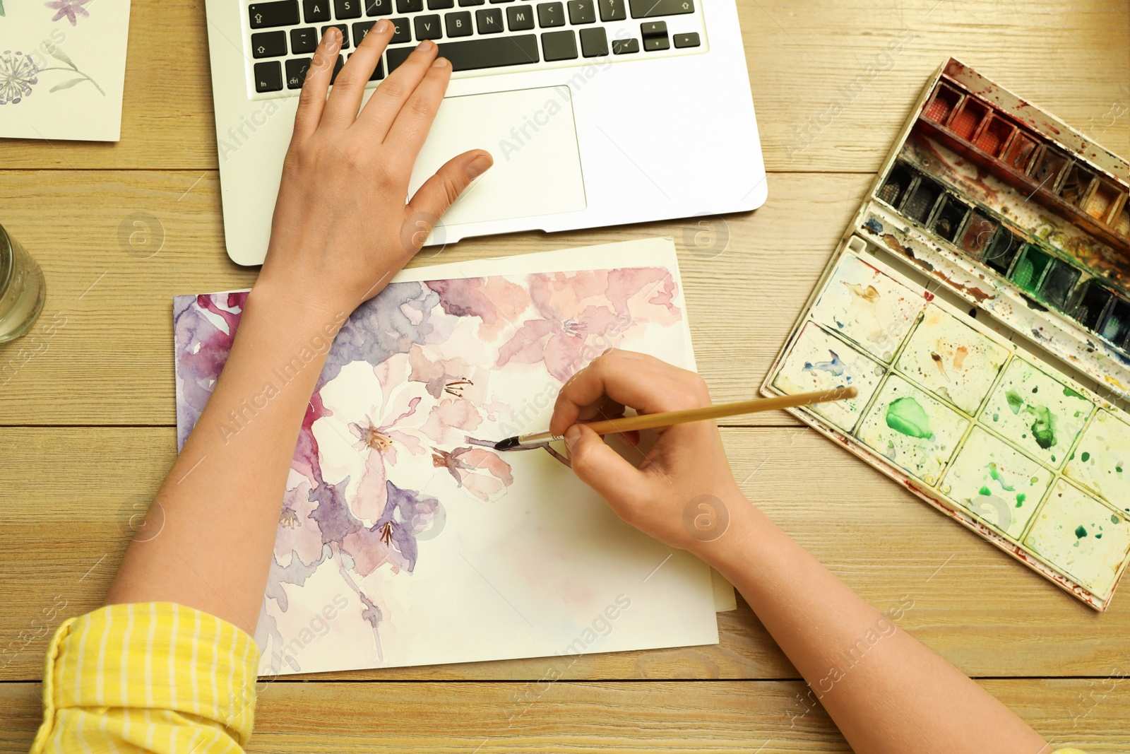 Photo of Woman drawing picture at online art lesson, top view. Distant learning