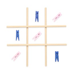 Photo of Tic tac toe game made with clothespins isolated on white, top view