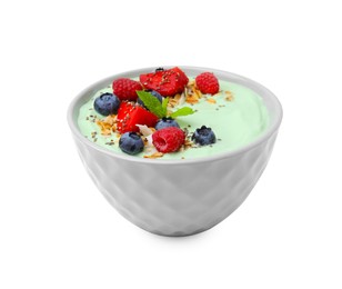 Tasty matcha smoothie bowl served with berries and oatmeal isolated on white. Healthy breakfast