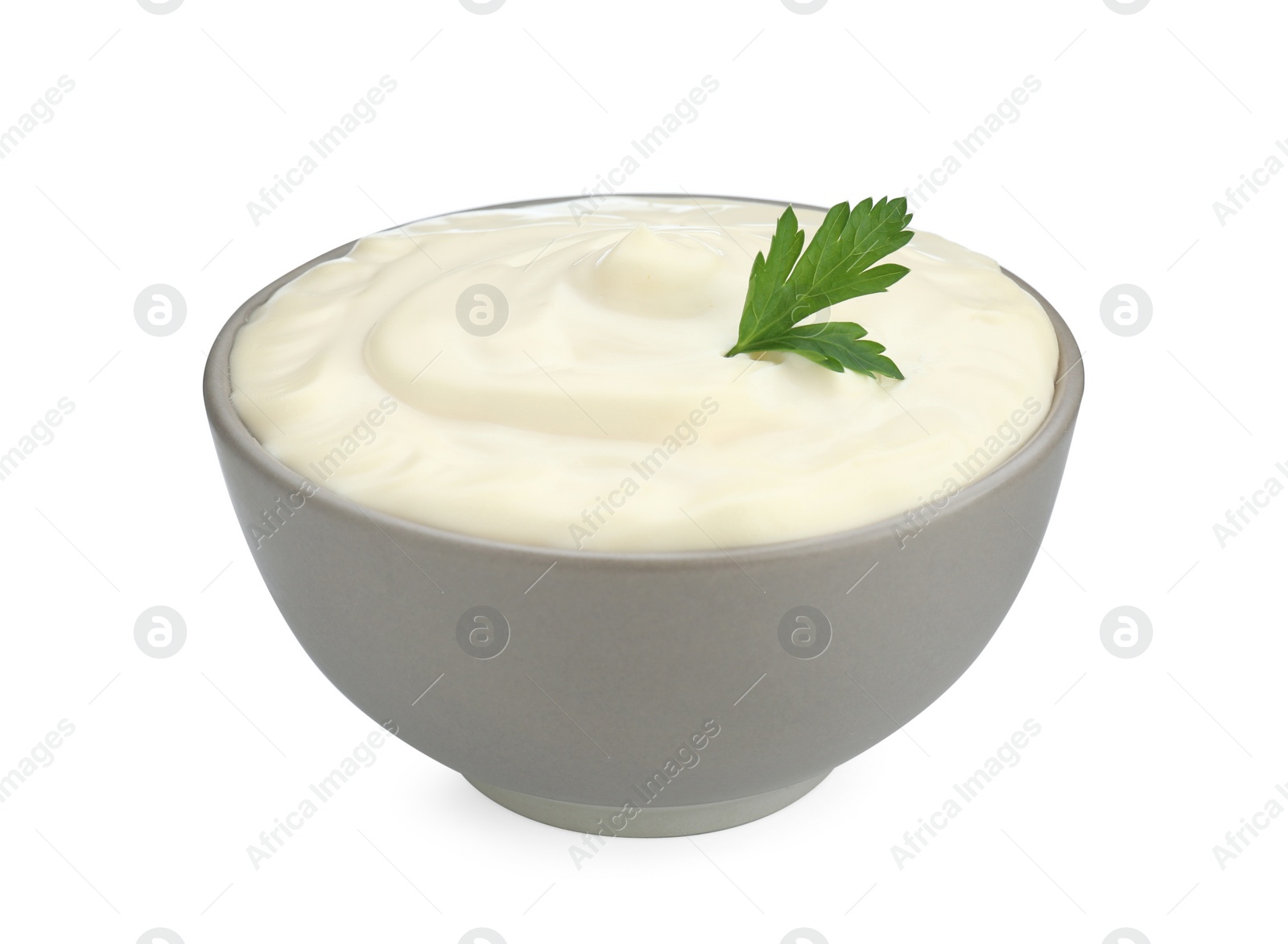 Photo of Tasty mayonnaise and parsley in bowl isolated on white