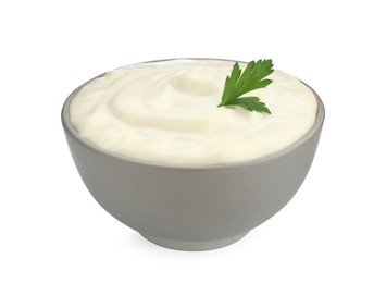 Photo of Tasty mayonnaise and parsley in bowl isolated on white