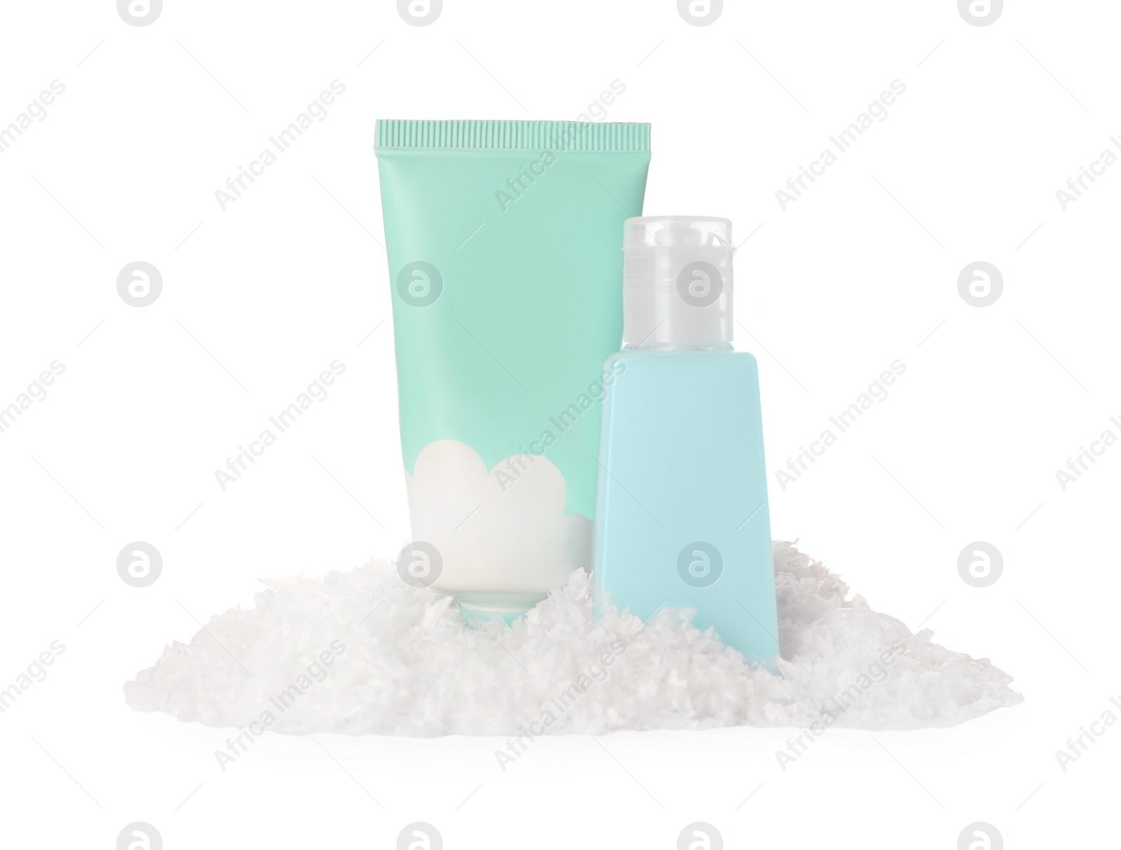 Photo of Set of cosmetic products with hand cream and Christmas decor isolated on white. Winter skin care