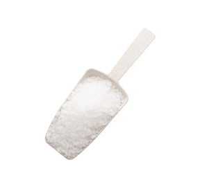 Photo of Plastic scoop with salt isolated on white, top view