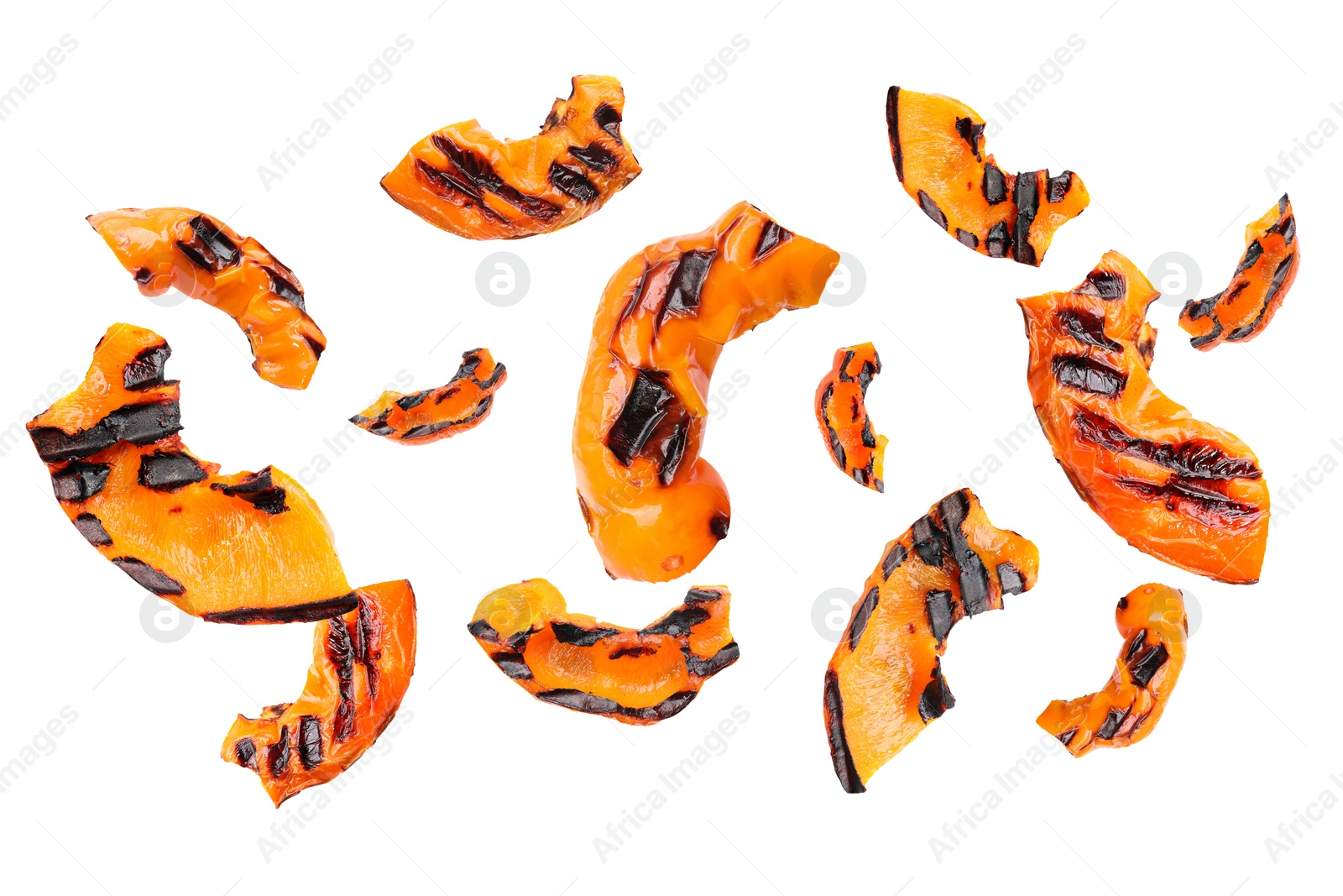 Image of Slices of grilled bell peppers in air on white background