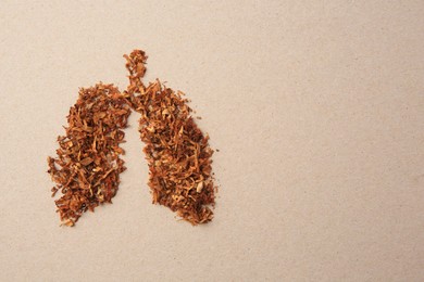 Human lungs made of tobacco on paper, top view and space for text. No smoking concept