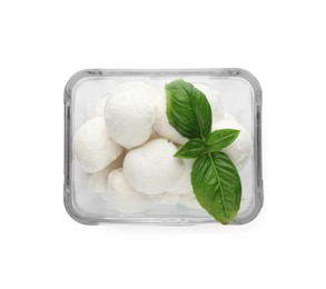 Photo of Bowl with mozzarella cheese balls and basil on white background, top view