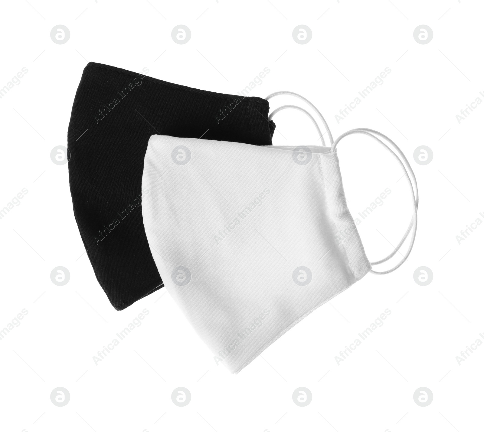 Photo of Homemade protective face masks isolated on white, top view