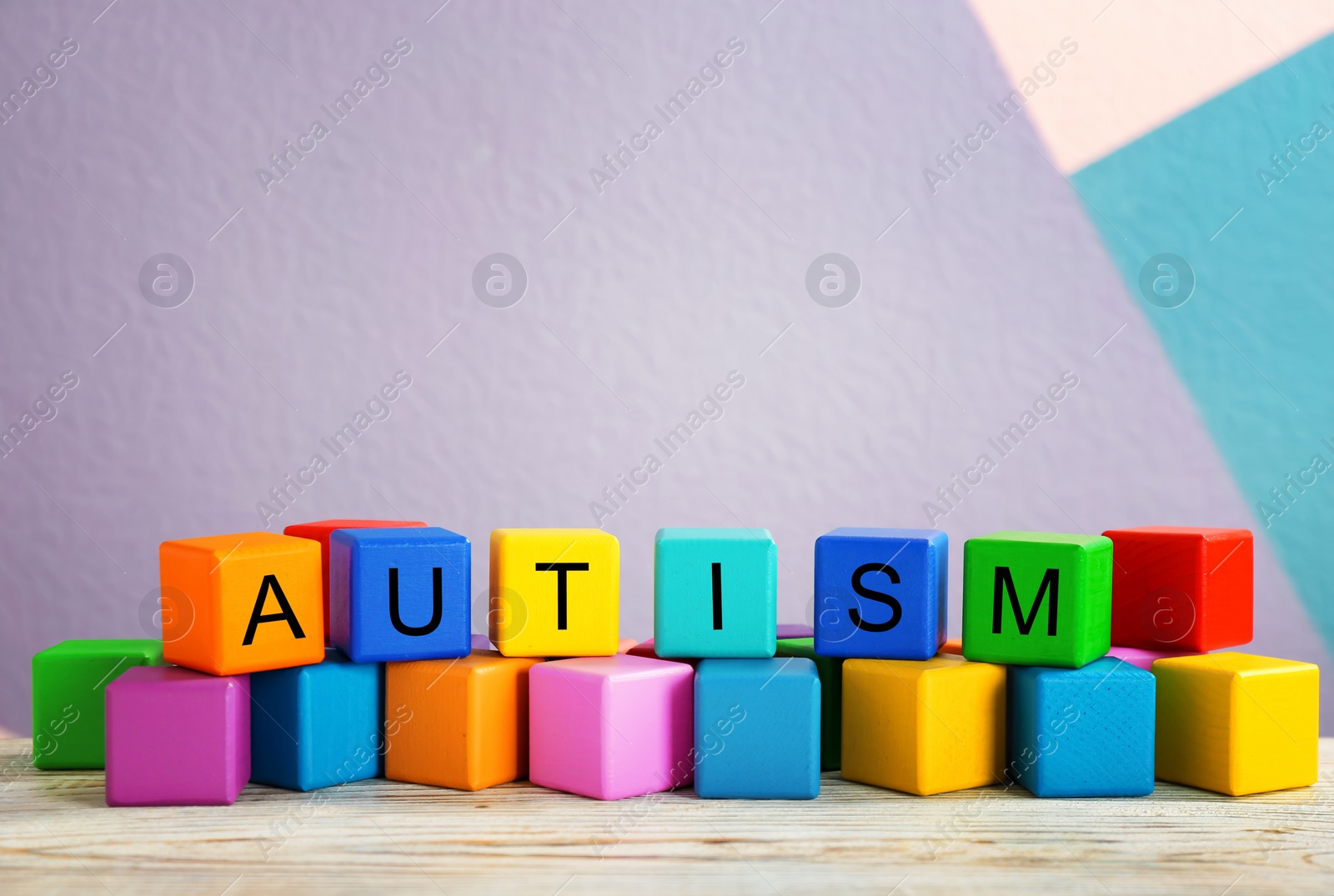 Photo of Cubes with word "Autism" on table