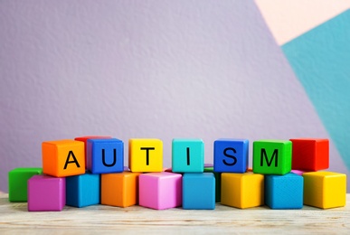 Photo of Cubes with word "Autism" on table