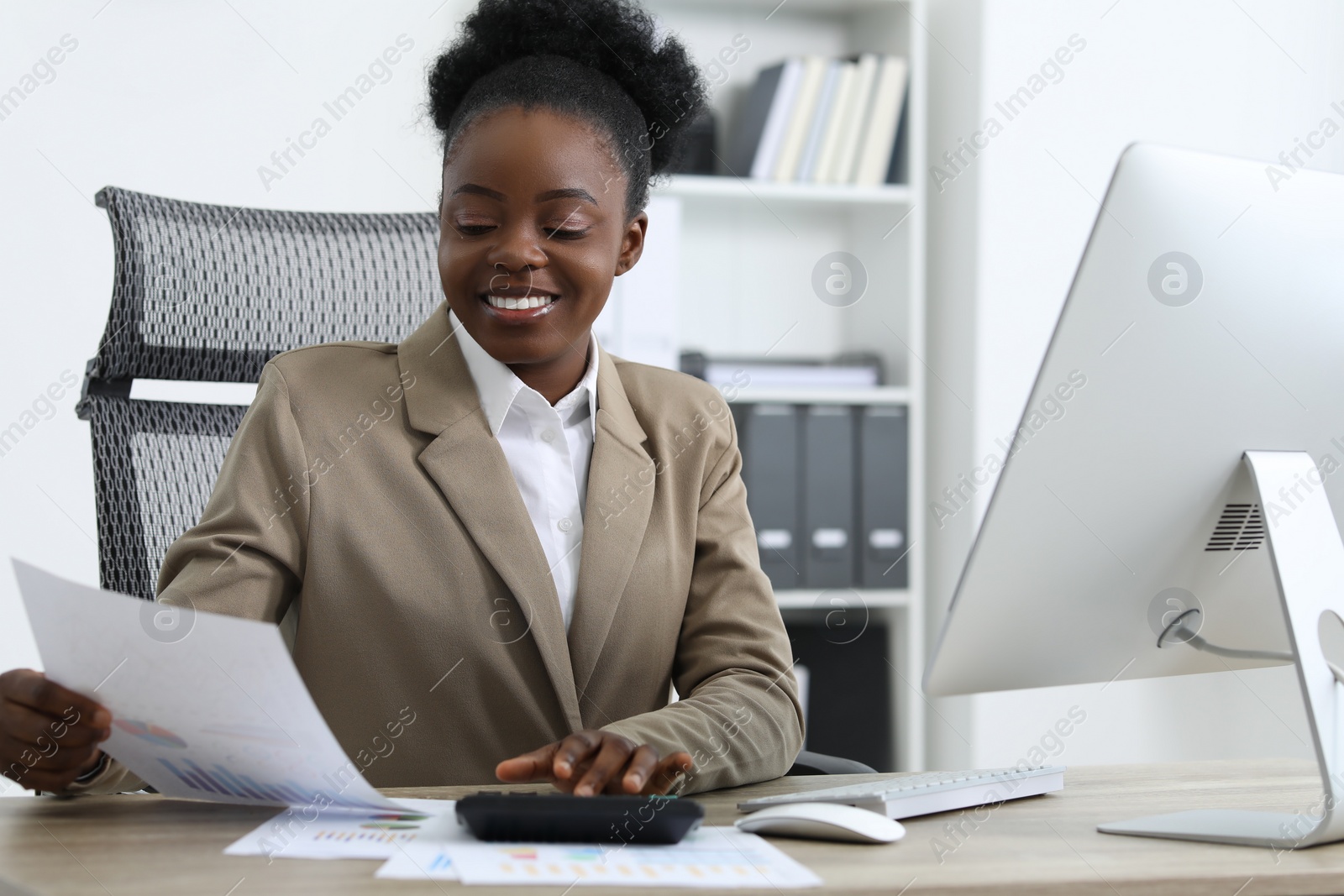 Photo of Professional accountant working at wooden desk in office