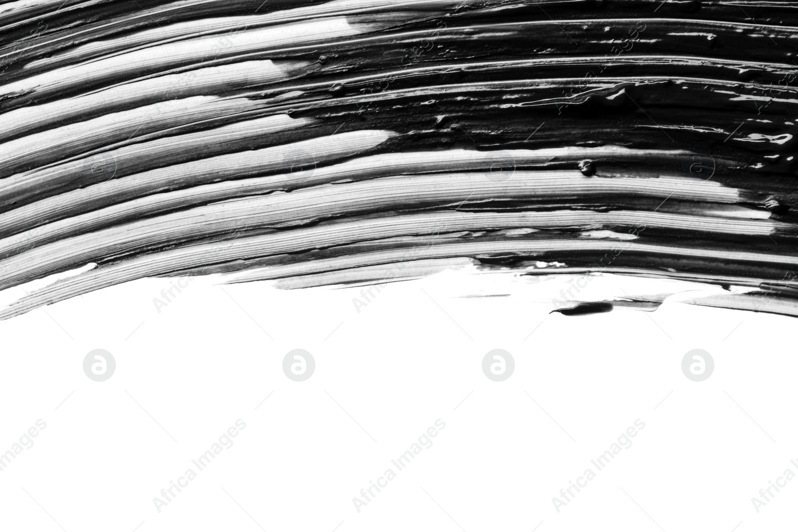 Photo of Smear of black mascara isolated on white, top view