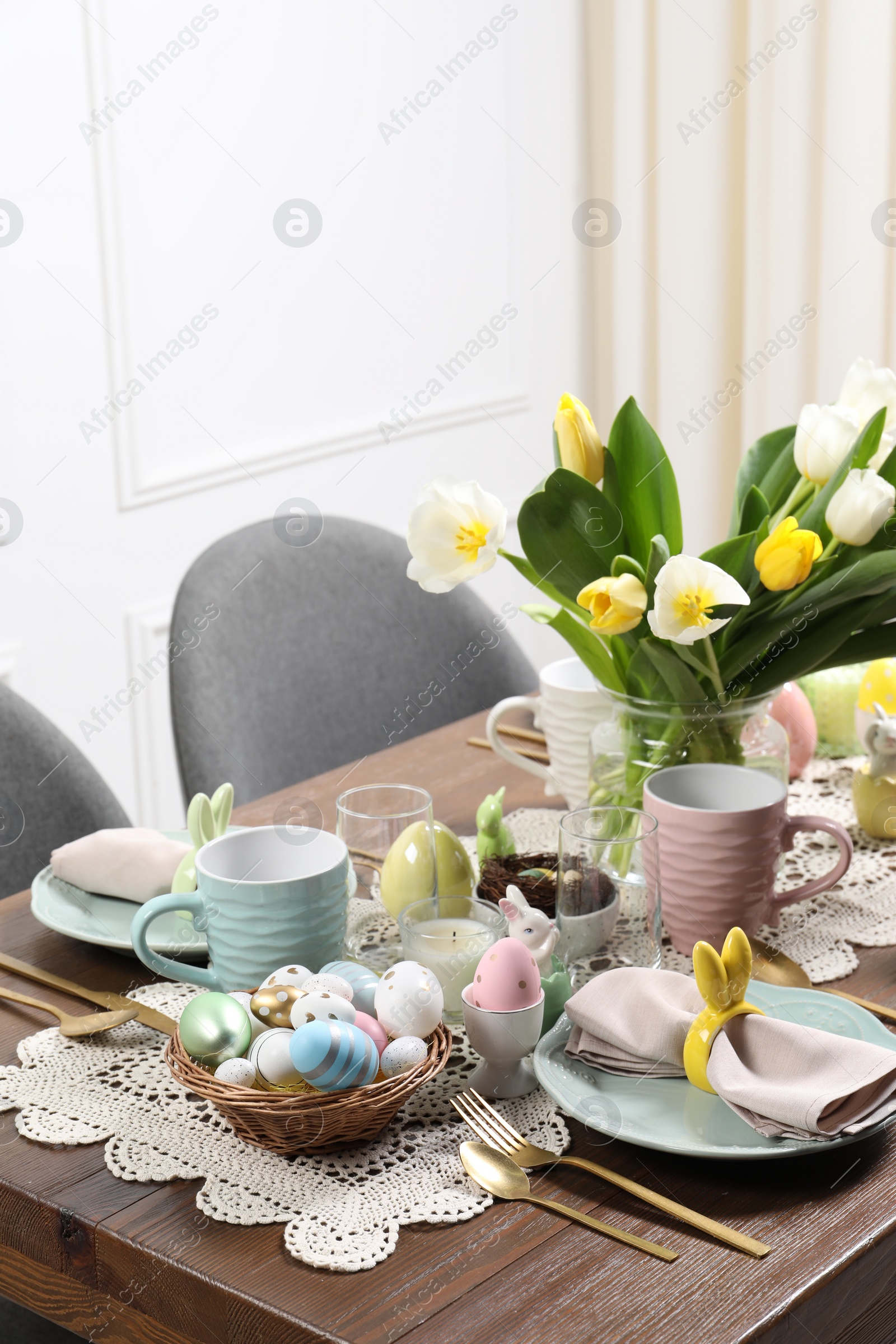 Photo of Festive table setting with beautiful flowers. Easter celebration