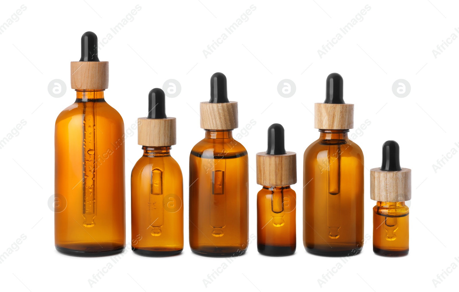 Photo of Row with different bottles of essential oil on white background