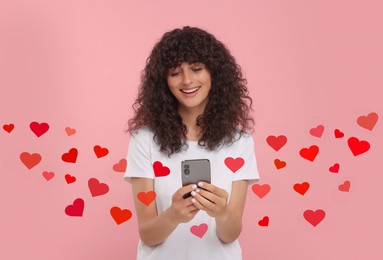 Long distance love. Woman chatting with sweetheart via smartphone on pink background. Hearts flying out of device and swirling around her