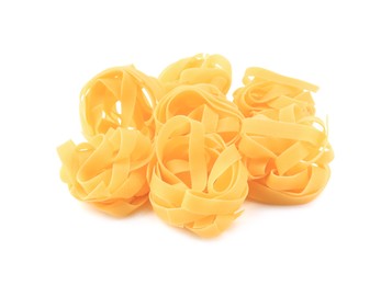 Photo of Raw fettuccine pasta isolated on white. Italian cuisine