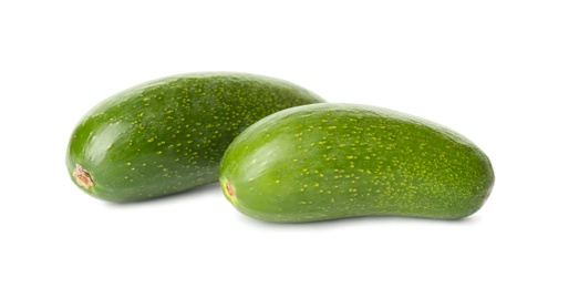 Photo of Fresh whole seedless avocados isolated on white