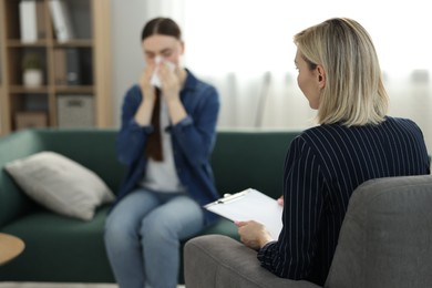 Professional psychotherapist working with patient in office