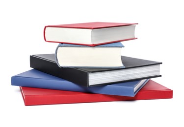 Stack of different hardcover books on white background